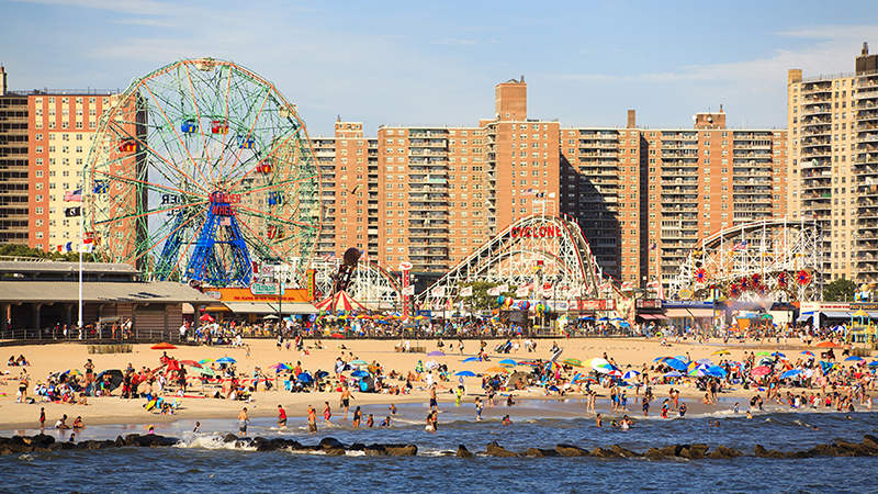 New York, NY, USA - August 30, 2016: Beach in Coney Island: People enjoy beach: Coney Island is a peninsular residential neighborhood, beach, and leisure/entertainment.; Shutterstock ID 484899217; Purchase Order: wabc